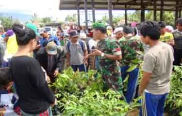 Plant seeds contribution ceremony and trees planting activities in Tambak Ratu Village, Batang Asai District, Sarolangun Regency, Jambi on October 1, 2013